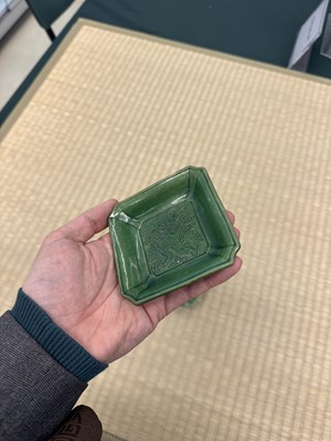 Lot 26 - A pair of small Chinese green-glazed 'dragon' dishes, Qing dynasty, Shunzhi period
