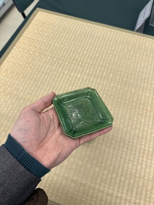 Lot 26 - A pair of small Chinese green-glazed 'dragon' dishes, Qing dynasty, Shunzhi period