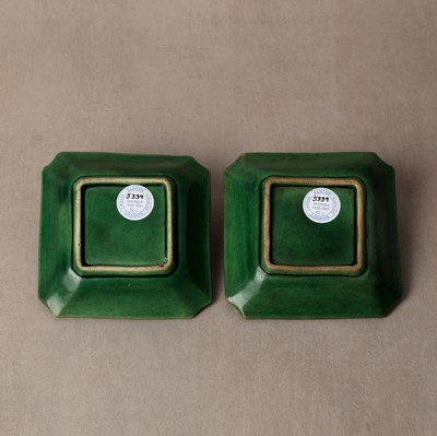 Lot 26 - A pair of small Chinese green-glazed 'dragon' dishes, Qing dynasty, Shunzhi period