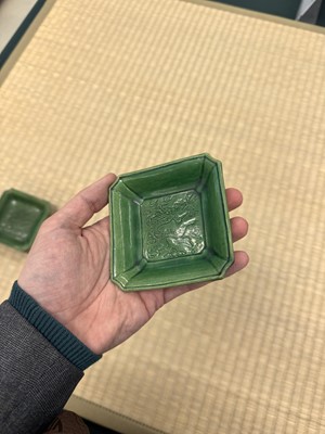 Lot 26 - A pair of small Chinese green-glazed 'dragon' dishes, Qing dynasty, Shunzhi period
