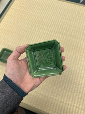 Lot 26 - A pair of small Chinese green-glazed 'dragon' dishes, Qing dynasty, Shunzhi period