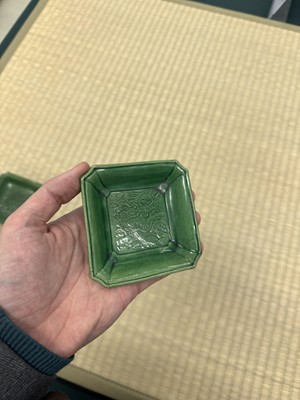 Lot 26 - A pair of small Chinese green-glazed 'dragon' dishes, Qing dynasty, Shunzhi period
