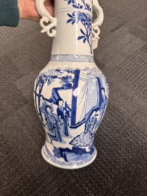 Lot 21 - A rare Chinese blue and white 'Yuanyang Tao' twin-handled vase, Qing dynasty, Kangxi period