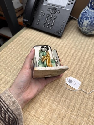 Lot 25 - A Chinese sancai-glazed biscuit 'love scene' brush holder, Qing dynasty, Kangxi period, circa 1690