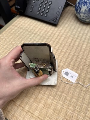 Lot 25 - A Chinese sancai-glazed biscuit 'love scene' brush holder, Qing dynasty, Kangxi period, circa 1690