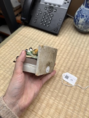 Lot 25 - A Chinese sancai-glazed biscuit 'love scene' brush holder, Qing dynasty, Kangxi period, circa 1690