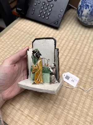 Lot 25 - A Chinese sancai-glazed biscuit 'love scene' brush holder, Qing dynasty, Kangxi period, circa 1690