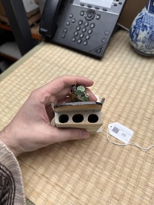 Lot 25 - A Chinese sancai-glazed biscuit 'love scene' brush holder, Qing dynasty, Kangxi period, circa 1690