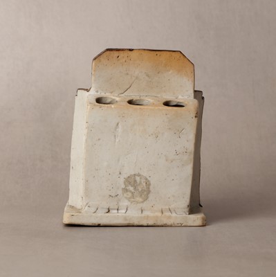 Lot 25 - A Chinese sancai-glazed biscuit 'love scene' brush holder, Qing dynasty, Kangxi period, circa 1690