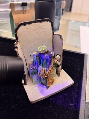 Lot 25 - A Chinese sancai-glazed biscuit 'love scene' brush holder, Qing dynasty, Kangxi period, circa 1690