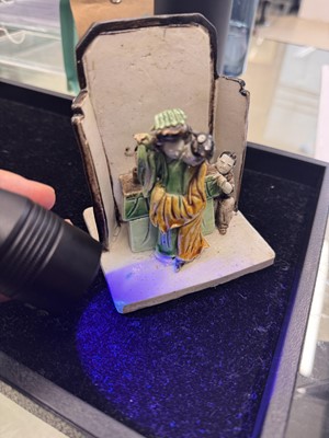 Lot 25 - A Chinese sancai-glazed biscuit 'love scene' brush holder, Qing dynasty, Kangxi period, circa 1690