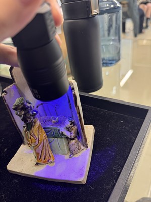 Lot 25 - A Chinese sancai-glazed biscuit 'love scene' brush holder, Qing dynasty, Kangxi period, circa 1690