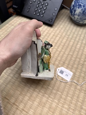 Lot 25 - A Chinese sancai-glazed biscuit 'love scene' brush holder, Qing dynasty, Kangxi period, circa 1690