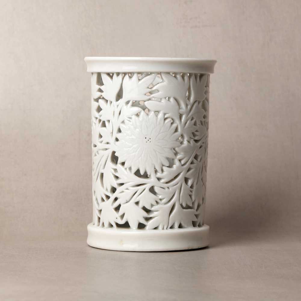 Lot 31 - A fine Chinese Dehua reticulated 'peony' brush pot, bitong, Qing dynasty, Kangxi period