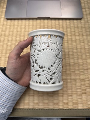 Lot 31 - A fine Chinese Dehua reticulated 'peony' brush pot, bitong, Qing dynasty, Kangxi period