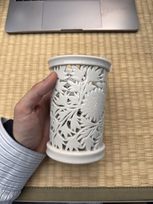 Lot 31 - A fine Chinese Dehua reticulated 'peony' brush pot, bitong, Qing dynasty, Kangxi period