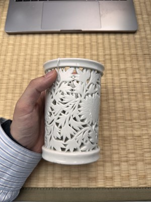 Lot 31 - A fine Chinese Dehua reticulated 'peony' brush pot, bitong, Qing dynasty, Kangxi period