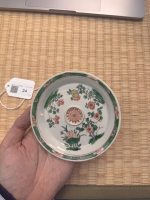 Lot 24 - A fine Chinese famille-verte tasse trembleuse, Qing dynasty, Kangxi period