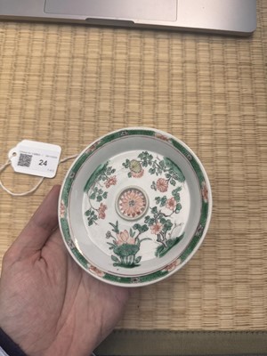 Lot 24 - A fine Chinese famille-verte tasse trembleuse, Qing dynasty, Kangxi period