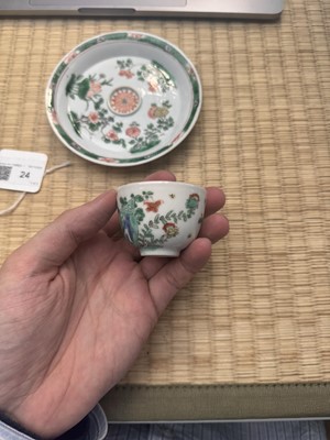 Lot 24 - A fine Chinese famille-verte tasse trembleuse, Qing dynasty, Kangxi period