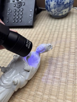 Lot 37 - A Chinese blanc-de-chine 'piggyback' figure group, Qing dynasty, Qianlong period, circa 1760