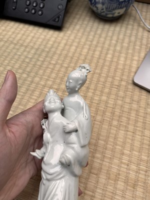 Lot 37 - A Chinese blanc-de-chine 'piggyback' figure group, Qing dynasty, Qianlong period, circa 1760