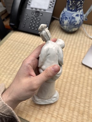 Lot 37 - A Chinese blanc-de-chine 'piggyback' figure group, Qing dynasty, Qianlong period, circa 1760