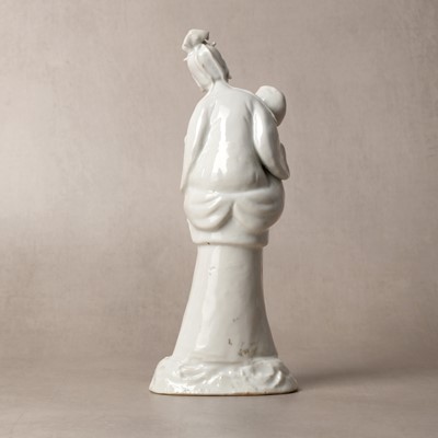 Lot 37 - A Chinese blanc-de-chine 'piggyback' figure group, Qing dynasty, Qianlong period, circa 1760