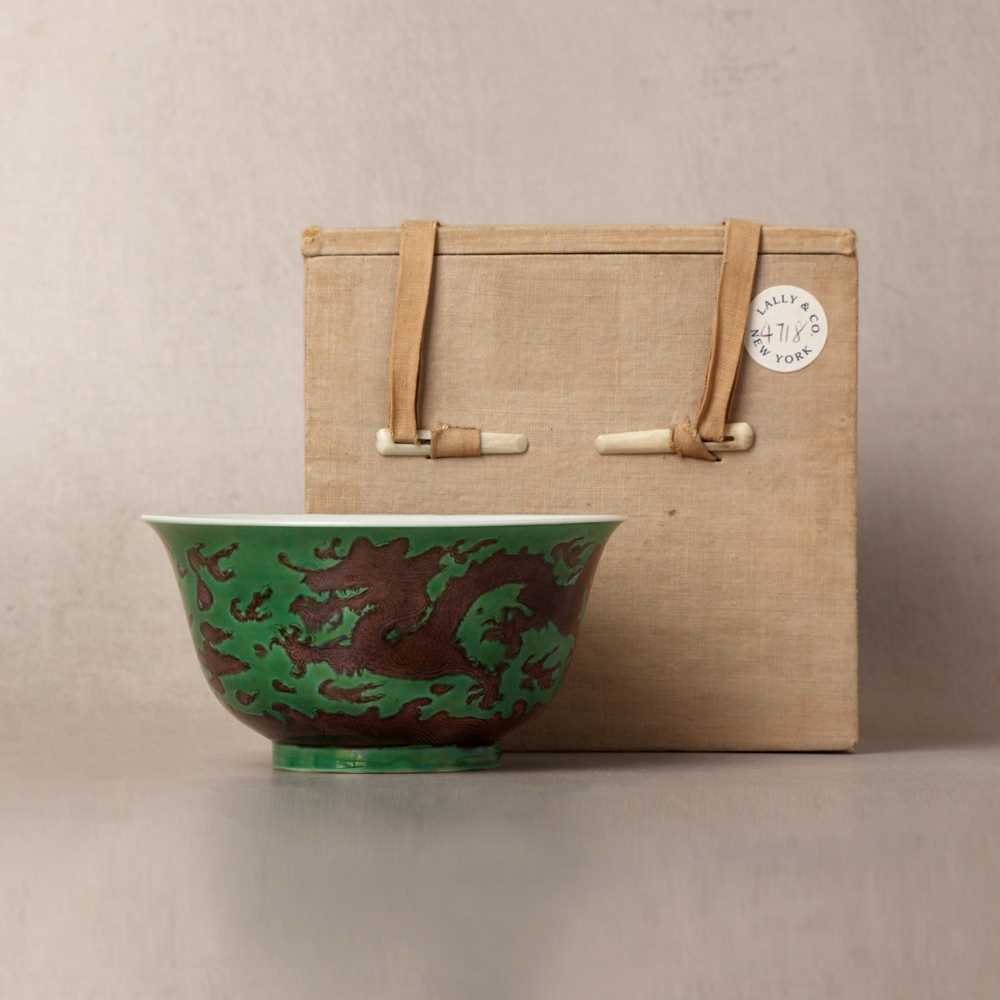 Lot 22 - ♦ A rare Chinese Imperial aubergine-enamelled 'dragon' bowl, Qing dynasty, Kangxi mark and period