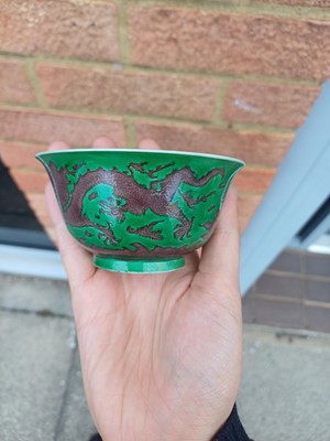 Lot 22 - ♦ A rare Chinese Imperial aubergine-enamelled 'dragon' bowl, Qing dynasty, Kangxi mark and period