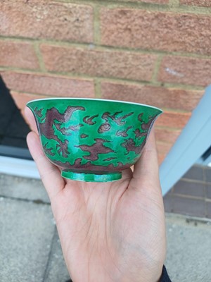 Lot 22 - ♦ A rare Chinese Imperial aubergine-enamelled 'dragon' bowl, Qing dynasty, Kangxi mark and period
