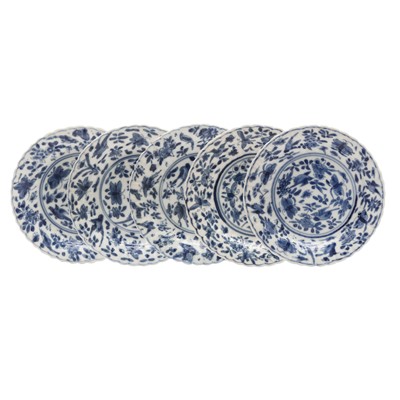 Lot 250 - Five Chinese blue and white 'birds and butterflies' dishes, Qing dynasty, Kangxi period