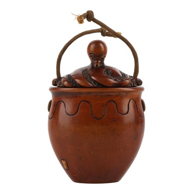 Lot 57 - A Japanese boxwood tonkotsu carved as a Takotsubo by Nobukazu, Meiji period