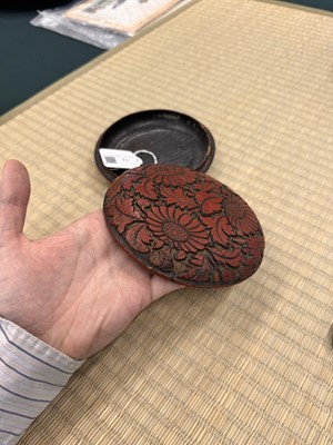 Lot 71 - A rare Chinese cinnabar lacquer 'chrysanthemum' box and cover, Ming dynasty