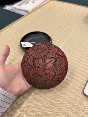 Lot 71 - A rare Chinese cinnabar lacquer 'chrysanthemum' box and cover, Ming dynasty