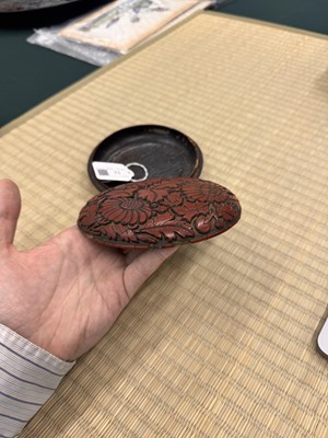 Lot 71 - A rare Chinese cinnabar lacquer 'chrysanthemum' box and cover, Ming dynasty