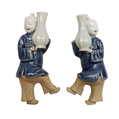 Lot 194 - A pair of Chinese blue and white 'boy' wall vases, Qing dynasty, Qianlong period