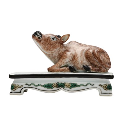 Lot 197 - A Chinese famille-rose 'recumbent buffalo' figure, Qing dynasty, Qianlong period