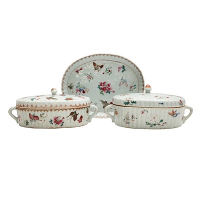Lot 213 - A pair of Chinese famille-rose 'butterflies' fluted oval tureens, Qing dynasty, Qianlong period