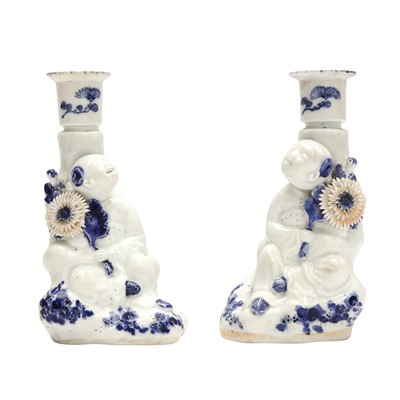 Lot 828 - A pair of Japanese Hirado blue and white candlestick holders, Meiji period, 19th century