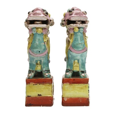 Lot 468 - A pair of Chinese famille-rose 'Buddhist lion' incense holders, Qing dynasty, 18th / 19th century
