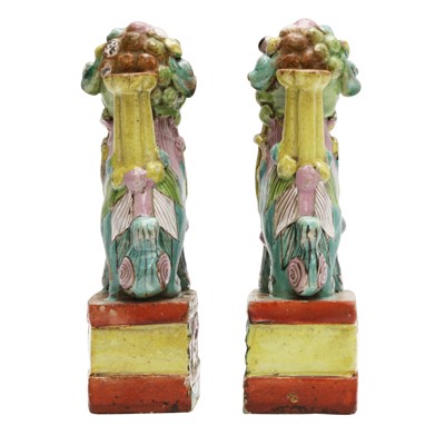 Lot 468 - A pair of Chinese famille-rose 'Buddhist lion' incense holders, Qing dynasty, 18th / 19th century