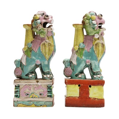 Lot 468 - A pair of Chinese famille-rose 'Buddhist lion' incense holders, Qing dynasty, 18th / 19th century