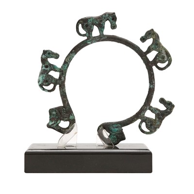 Lot 518 - A Chinese archaic bronze 'four horses' fixture, Warring States period