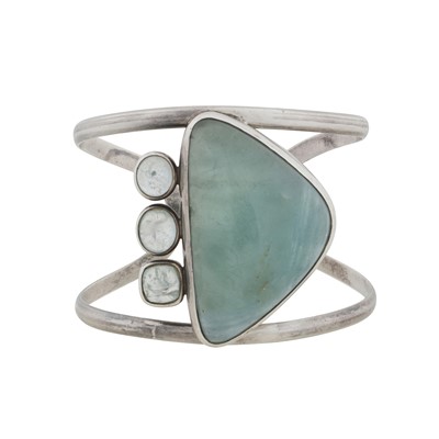 Lot 301 - An aquamarine and rock crystal cuff bangle