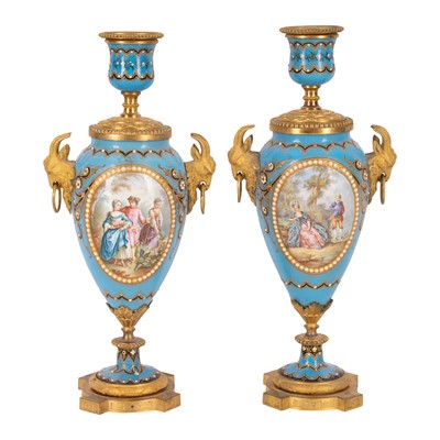Lot 8 - A pair of Sevres style porcelain and ormolu mounted lidded vases