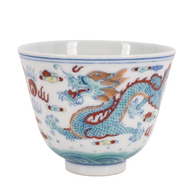 Lot 301 - A Chinese doucai 'dragons' cup, 20th century, bai yi zhai zhi mark