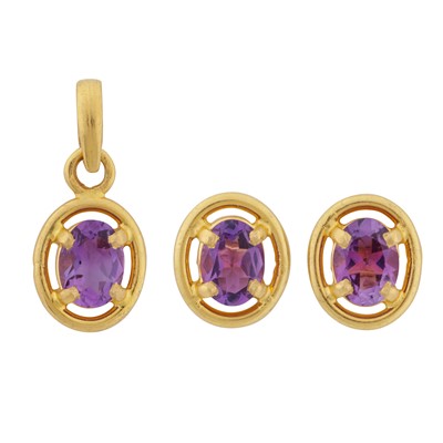 Lot 6 - An amethyst pendant and stud earrings suite