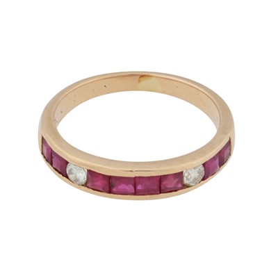 Lot 39 - A ruby and diamond half eternity ring