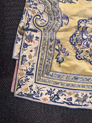 Lot 395 - A fine Chinese yellow-ground embroidered silk robe, Qing dynasty, 19th Century